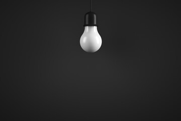 Hanging lamp. Classic light bulb. Dark background. Copy space.