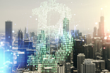 Double exposure of creative Bitcoin symbol hologram on Chicago city skyscrapers background. Cryptocurrency concept