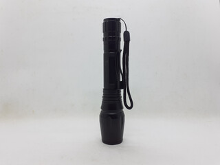 Black Electric LED Flashlight Powered by Rechargeable Battery in White Isolated Background