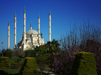 Fototapeta na wymiar Mosque with six minarets in Adana, Turkey. Mosque, river and bridge view together.