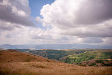 Dramatic clouds over canyons and mountainous landscape in the south of Armenia