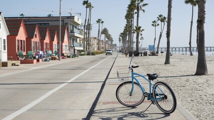 Blue bicycle, cruiser bike by ocean beach, pacific coast, Oceanside California USA. Summertime...