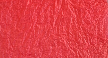 Obraz premium Red bright crumpled textured paper background