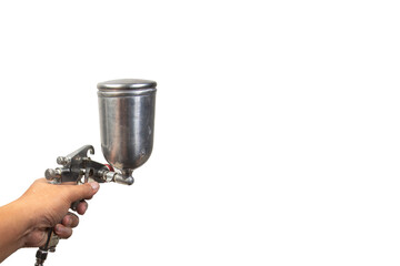 Image of the painter's arm hand holding industrial size spray gun used for industrial painting and...