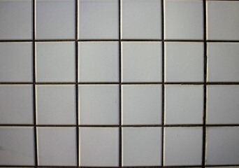 evocative image of white and square tile wall texture