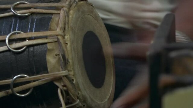 Close-up of man playing madal, Kathmandu, Bagmati Province, Nepal