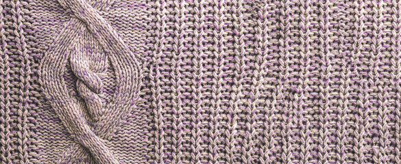 Texture background of purple knitted fabric sweaters, macro textile banner and background, cozy home pattern