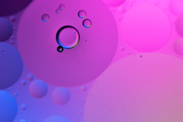 macro oil water photography Abstract background and texture of bubbles light multi color illumination.  art water surface for your products display and artwork design with copy space. Watery glare 