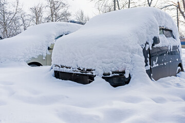 the consequences of heavy snowfall of a car under the snow