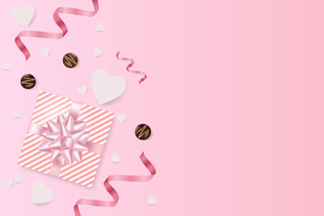 Romantic creative composition.Festive decorative items gift box, chocolates, paper hearts, pink streamer.Holiday banner and poster.
