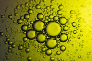 macro oil water photography Abstract background and texture of bubbles light multi color illumination.  art water surface for your products display and artwork design with copy space. Watery glare 