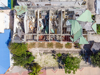 Damage roof building in the caribbean island of St Maarten. Hurricane roof damage.