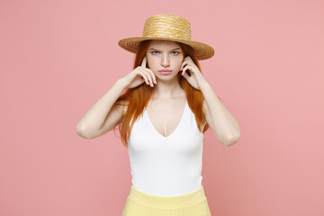 Young irritated naughty angry serious redhead woman 20s ginger long hair wear straw hat summer...