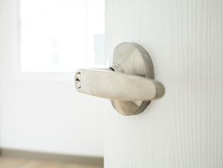 Open the door. Door with chrome metal handle
