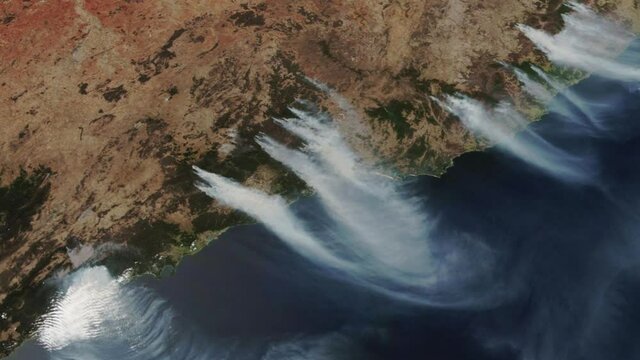The Australian fires burning viewed from space from a satellite. Contains public domain image by NASA.