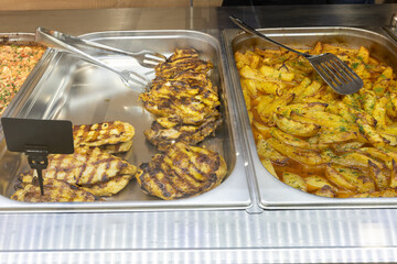 Take-out food in showcase window. Food for home.