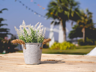 A flowerpot placed on a wooden table