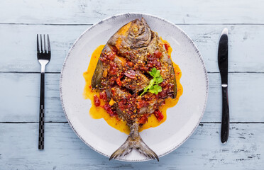 Deep fried pomfret fish and chili sauce