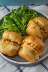 Bandung, Indonesia - January 24 2021 :  Chicken minced meat sandwich with salad toping