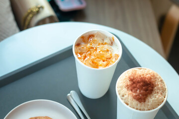 Ice tea with caramel sauce and milk 