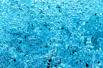 Frost. Winter background. Ice with close-up air bubbles. Winter.