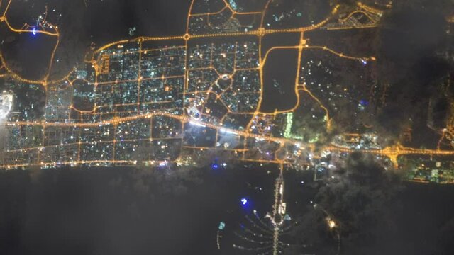 Dubai city during the nighttime view from space from a satellite. Contains public domain image by NASA.