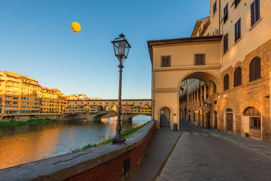 a balloon at sunrise over the ponte vecchio of Florence, Italy