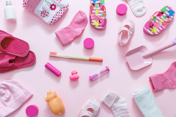 Obraz na płótnie Canvas Baby girl accesories on pink background, baby shower concept