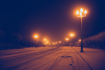 Street at night after snow in winter