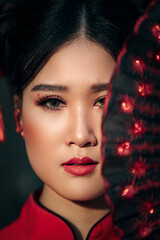 Happy Chinese new year. Asian woman wearing traditional chinese red dress  