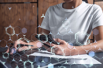 Woman hands typing the keyboard to create innovative software to change the world and provide a completely new service. Close up shot. Hologram tech graphs. Concept of Dev team. Casual wear.