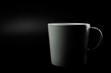 Coffee mug cup with light and shadow modern style on single position and presentation black background, empty tea cup isolated wallpaper.
