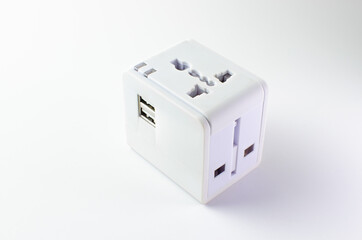 Universal plug and USB adapter on white background, mobile phone and electronic equipment accessory