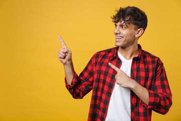 Young spanish latinos smiling handsome fashionable man 20s wearing red checkered shirt looking...