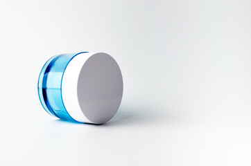 Beauty cosmetic blue color on white background isolated, face care cream, dropper, brush on for healthy make up. Product container design bottles. Skin care products on empty background