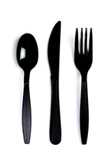 Black plastic cutlery knife fork spoon isolated on white background low highlight. For kitchen...