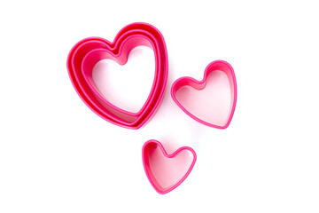 Plastic pink molds for making cookies in the shape of a hearts