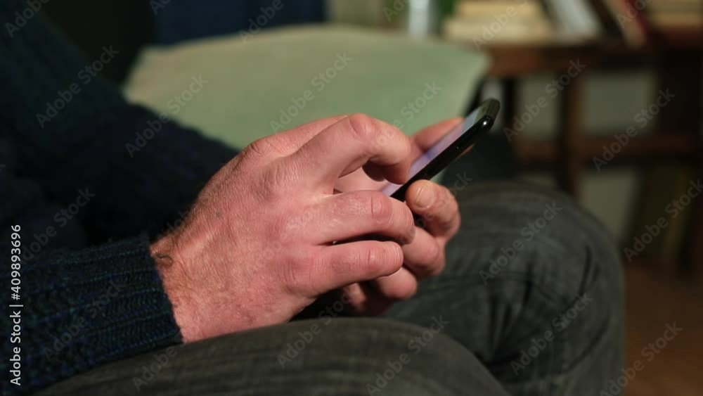 Poster close-up of using the phone in hand. the man's fingers scroll across the screen. getting information