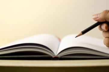 Lovely open book pages, study notes, love letter diary for hobbies concepts. Warm and welcoming color tone. Set up up wood table clear white background