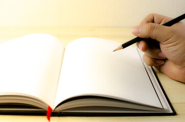 Lovely open book pages, study notes, love letter diary for hobbies concepts. Warm and welcoming color tone. Set up up wood table clear white background