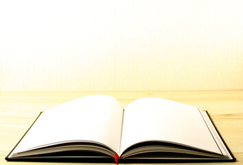 Lovely open book pages, study notes, love letter diary for hobbies concepts. Warm and welcoming color tone. Set up up wood table clear white background