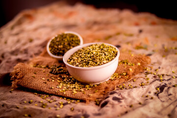 Whole moong-mung bean and wooden spoon heap,moong bean green gram or maash top view background,Pile of green beans