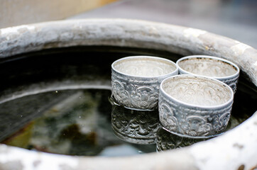 Zinc steel mini cup for watering, tradition container in Thai's people life floating on water