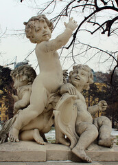 Vienna. Austria. 29 February 2020. Putti Sculpture in Burggarten at Hofburg in Vienna. Figures of three little boys in the Imperial Park.