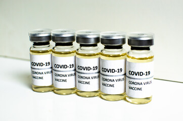 Covid-19 or Coronavirus vaccine in mini medicine bottles on white background, concern disease pharmacy in laboratory and drug to cure people. Healthcare and Medical concept. Development of research.