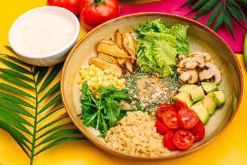 Healthy eating. Salad with mushrooms, lettuce, tomatoes and zucchini on a decorated table