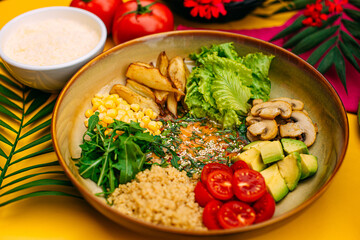 Healthy eating. Salad with mushrooms, lettuce, tomatoes and zucchini on a decorated table