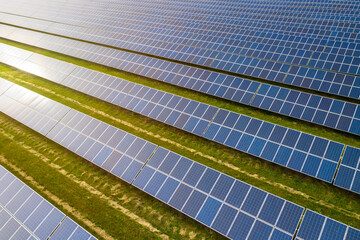 Industrial landscape with blue solar panels. Photovoltaic modules for renewable energy.