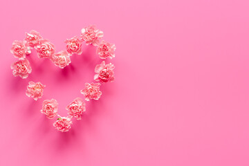 Heart shape of pink flowers. Valentines Day, wedding or birthday background