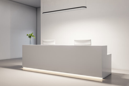 Bright office lobby with white reception desk